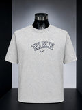 Nike Vintage Wash Athletic Logo T-Shirt (specifically in a grey acid/mineral wash colorway).