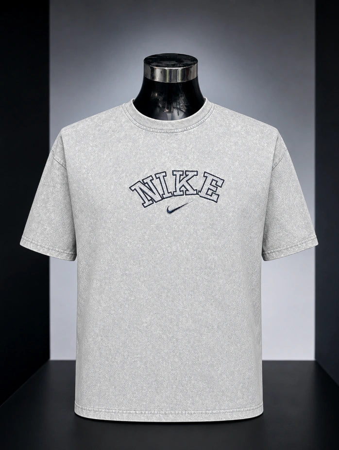 Nike Vintage Wash Athletic Logo T-Shirt (specifically in a grey acid/mineral wash colorway).