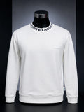 Lacoste Men's Jacquard Branded Jersey Sweatshirt (in the white/black colorway)